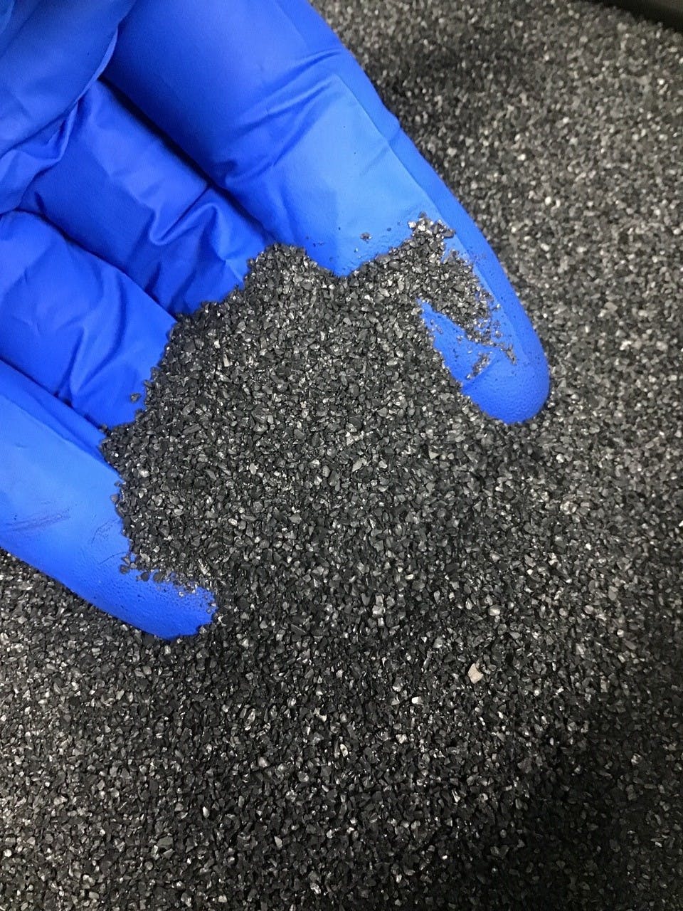 Considering how materials such as this activated carbon will flow through a process and between processing steps without hangups is critical to designing a successful system.