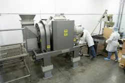 The 15-cubic-foot (425-liter) capacity rotary batch mixer discharges to a screw conveyer which transfers mixed powder products to an auger filling machine. The 15-cubic-foot (425-liter) capacity rotary batch mixer discharges to a screw conveyer which transfers mixed powder products to an auger filling machine.