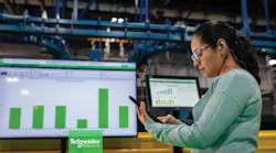 Worker looking at automated process display Worker looking at automated process display