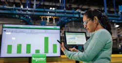 Worker looking at automated process display Worker looking at automated process display