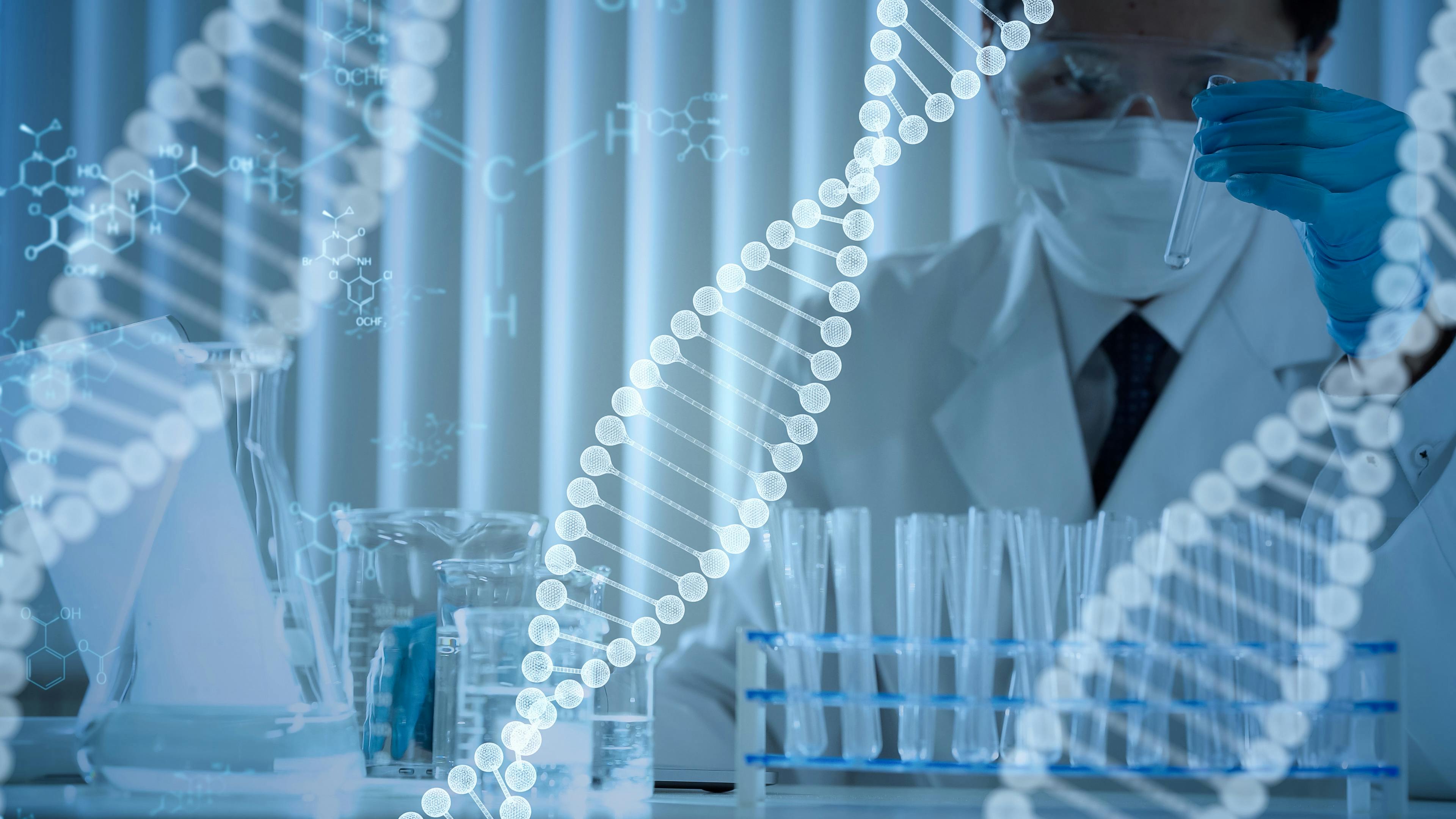 Digital DNA structures sit in foreground and in background a researcher test vials