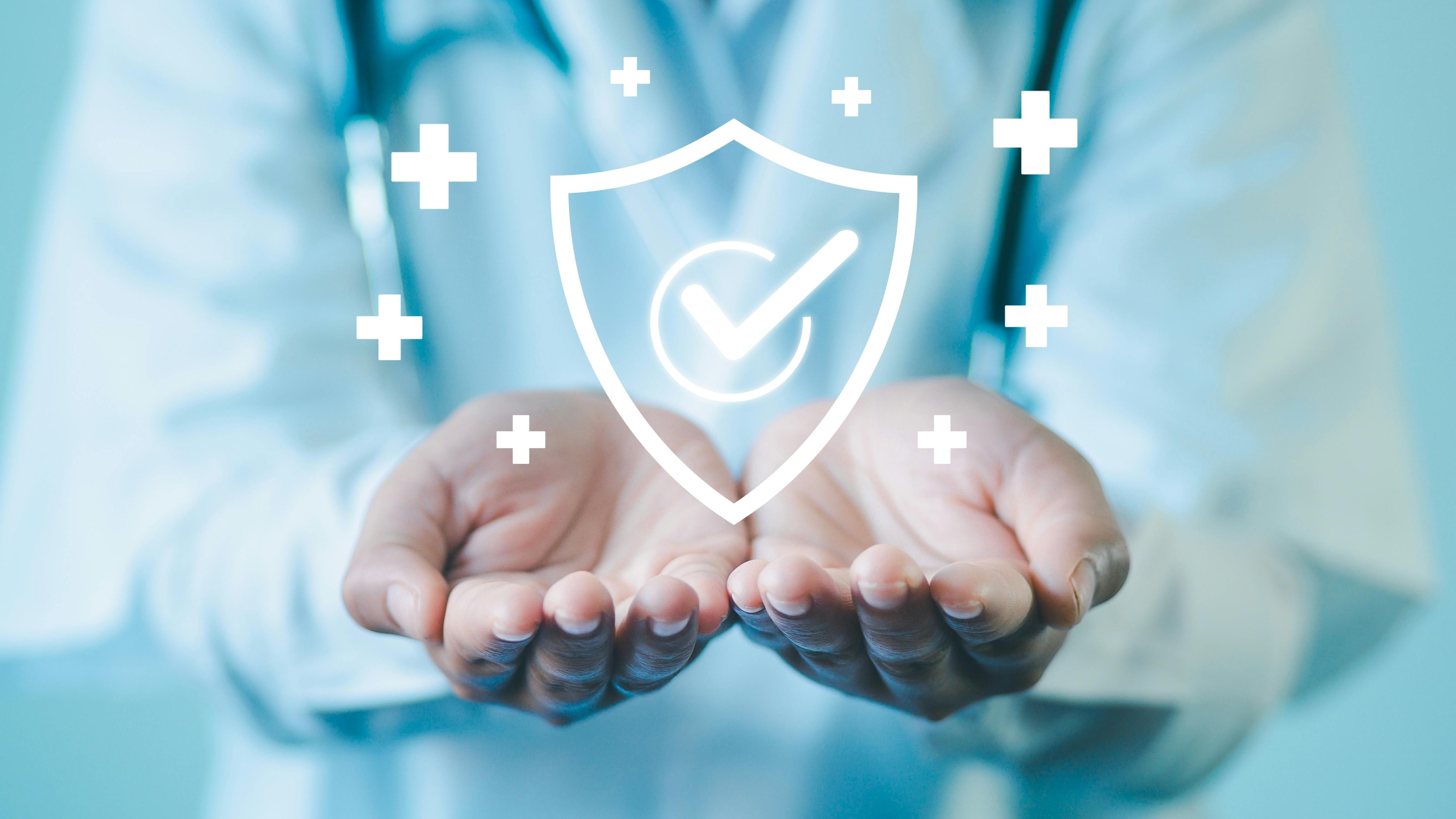 GMP Good Manufacturing Practice concept. Cupped hands hold digital medical approval symbol.