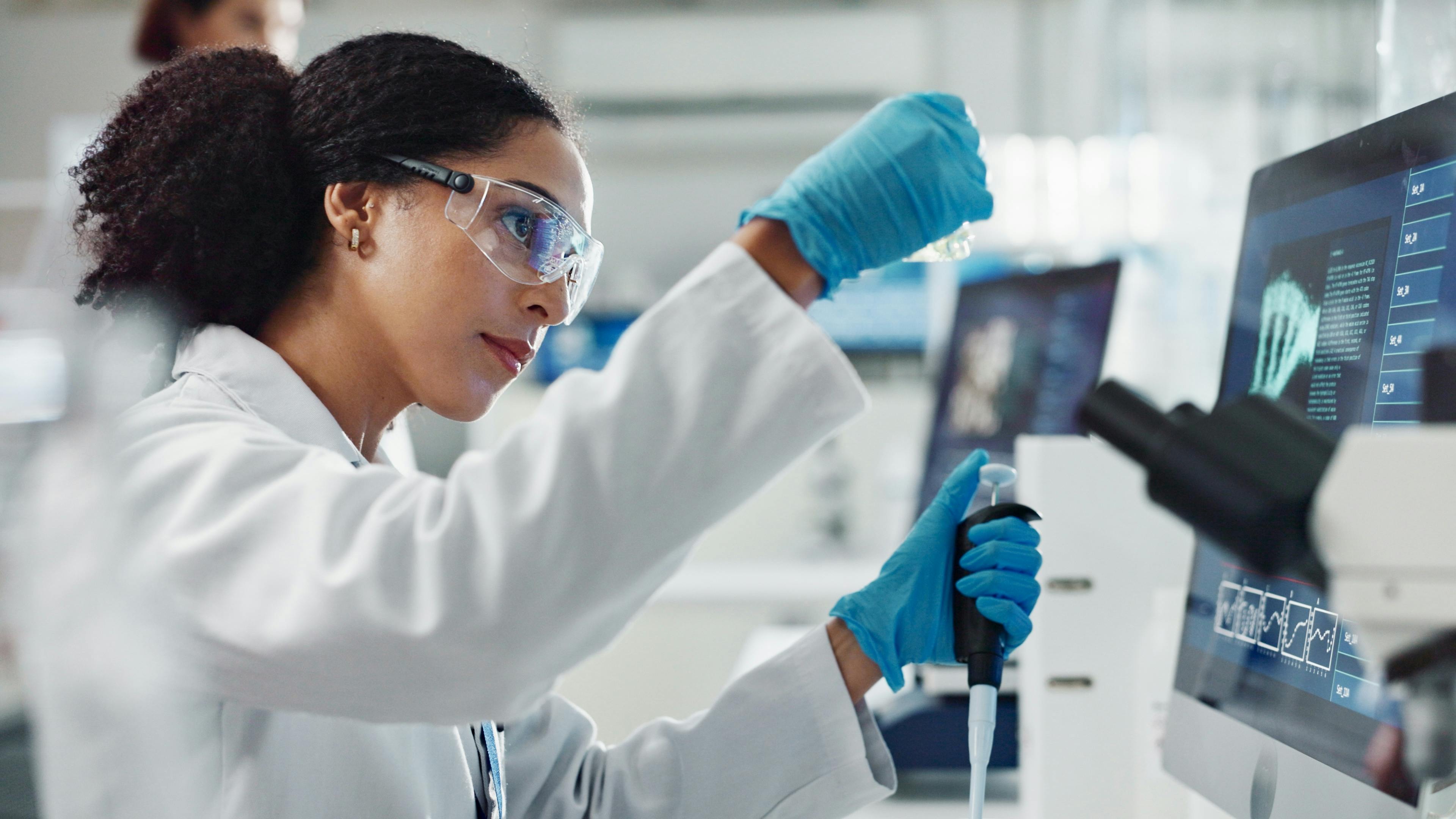 Glass vial, pipette and woman scientist in laboratory for medical study, research or experiment. Test tube, dropper and professional female person with chemical liquid for pharmaceutical innovation.