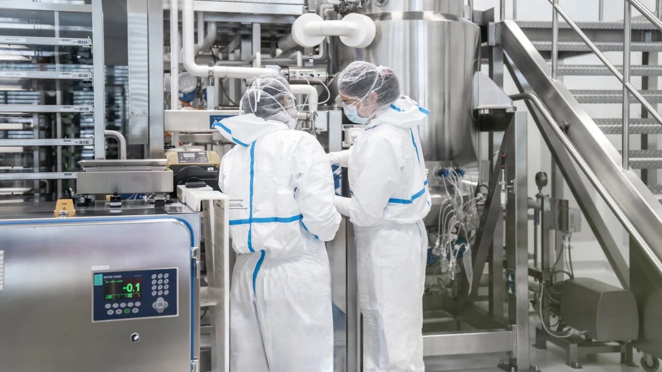 Two workers in Lonza Bioconjugates facility in Visp, Switzerland