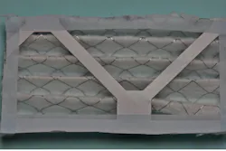 Figure 3a: Cut out air filter to size; the tape protects from sharp wire. Figure 3a: Cut out air filter to size; the tape protects from sharp wire.