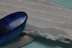 Figure 5: Staple front surface of mask to metal wire mesh side in approximately three sites on each edge. Figure 5: Staple front surface of mask to metal wire mesh side in approximately three sites on each edge.