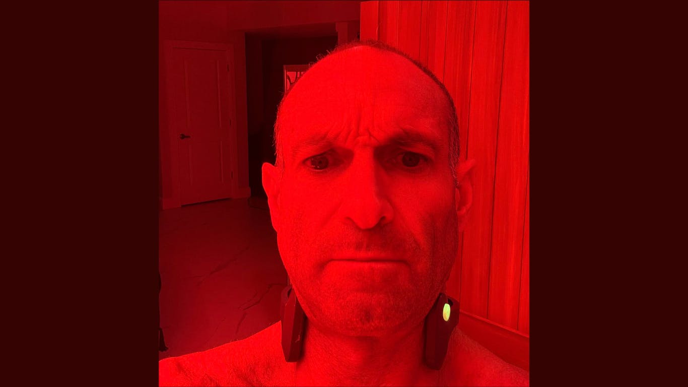 man getting vagus nerve stimulation along with red light therapy