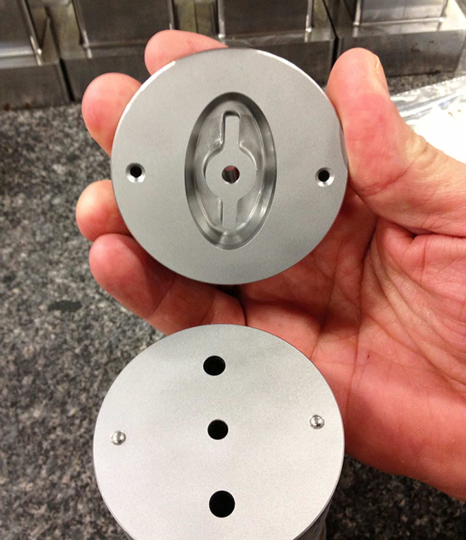 Conformal cooling channels are designed to flow water around the ejector pin and trim the cooling cycle time for this deodorant cap by 50 percent.
