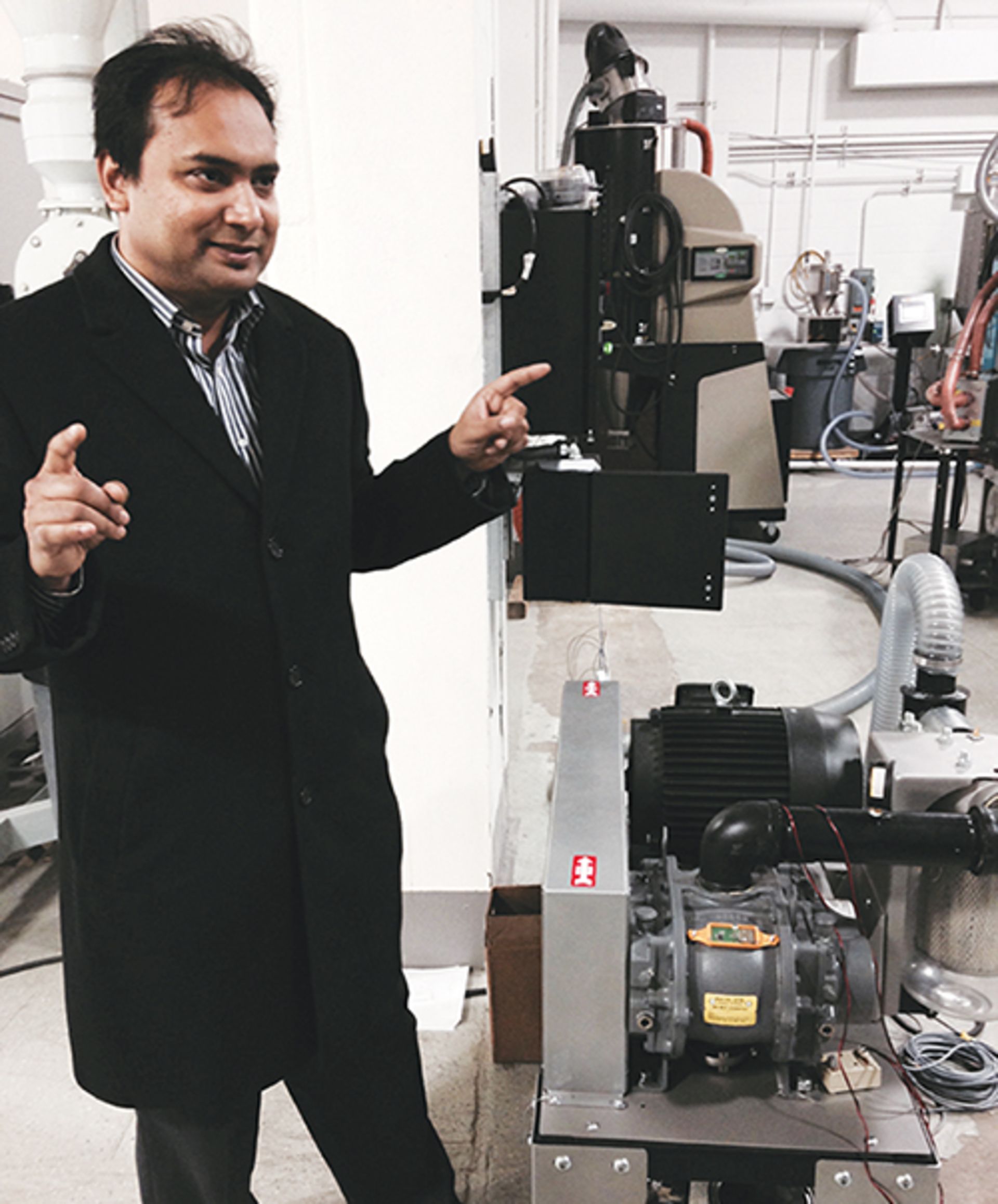 Biplab Pal of Prophecy Sensorlytics discusses his firm's 'wearable' sensor technology, seen here affixed to a blower on a vacuum pump..