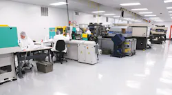 Workers perform tasks in Tech-Way's Class 100,000 clean room. Workers perform tasks in Tech-Way's Class 100,000 clean room.