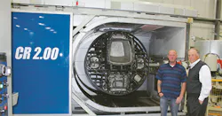 Simplay3 founder Tom Murdough, right, and plant manager Gabe Parsons stand beside a Rotoline rotomolding machine. Simplay3 founder Tom Murdough, right, and plant manager Gabe Parsons stand beside a Rotoline rotomolding machine.