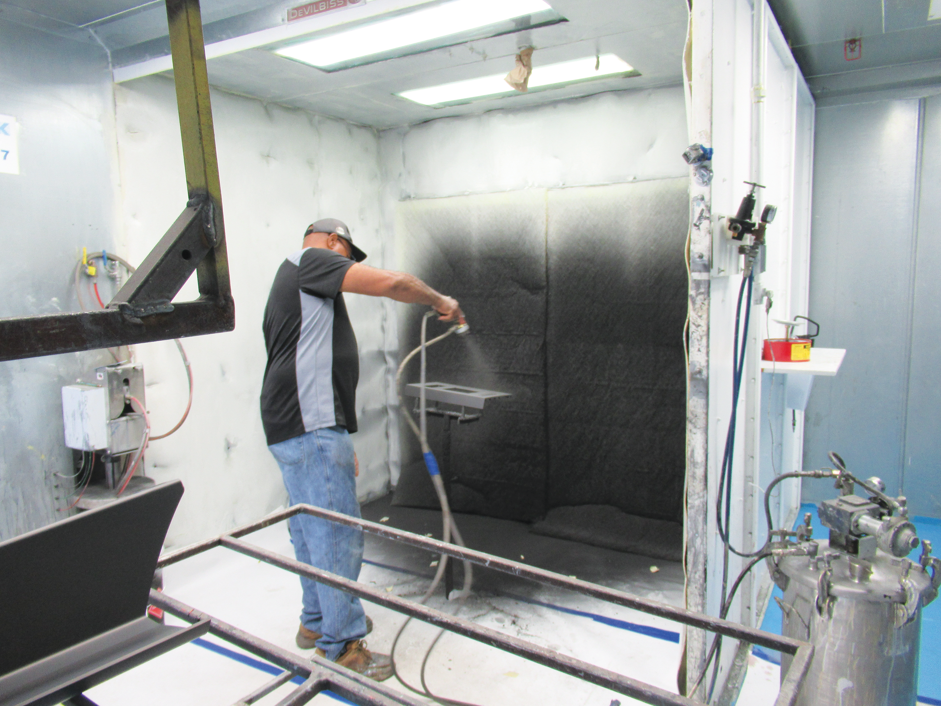 A manual spray-painting operation is part of a 10-booth clean-room system at Mack Molding&rsquo;s Statesville, N.C., facility.