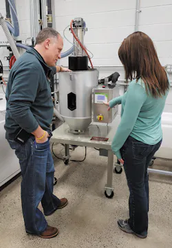 Matrix Tool GM Dave Moyak and engineer Savannah Custard check settings on one of the company’s 20 Conair MicroWheel dryers. Matrix Tool GM Dave Moyak and engineer Savannah Custard check settings on one of the company’s 20 Conair MicroWheel dryers.