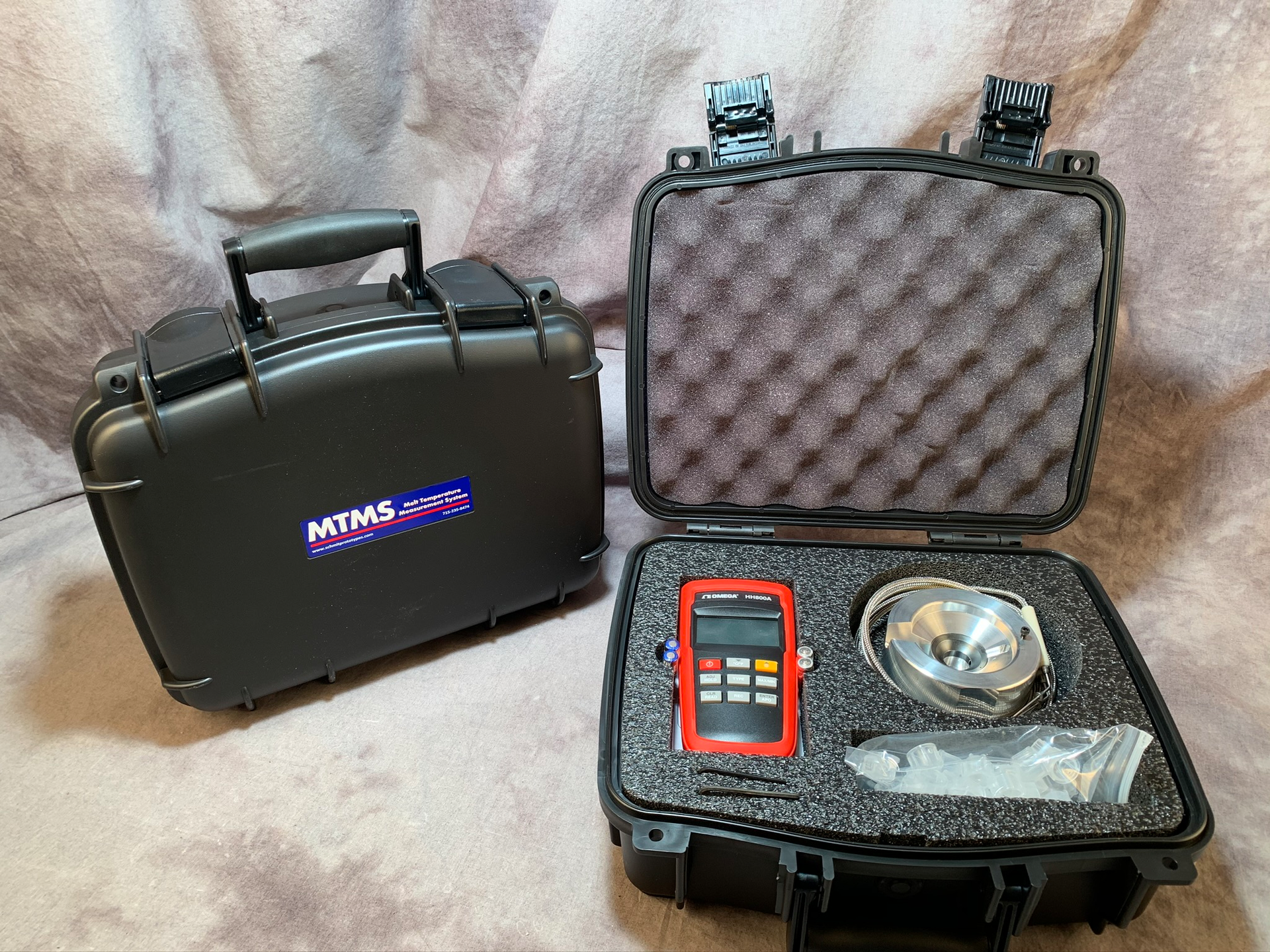 The new melt temperature measurement system available through Schmit Prototypes uses a pyrometer, two thermocouple couples and a special cup made of plastic to determine the temperature of melt within the barrel.