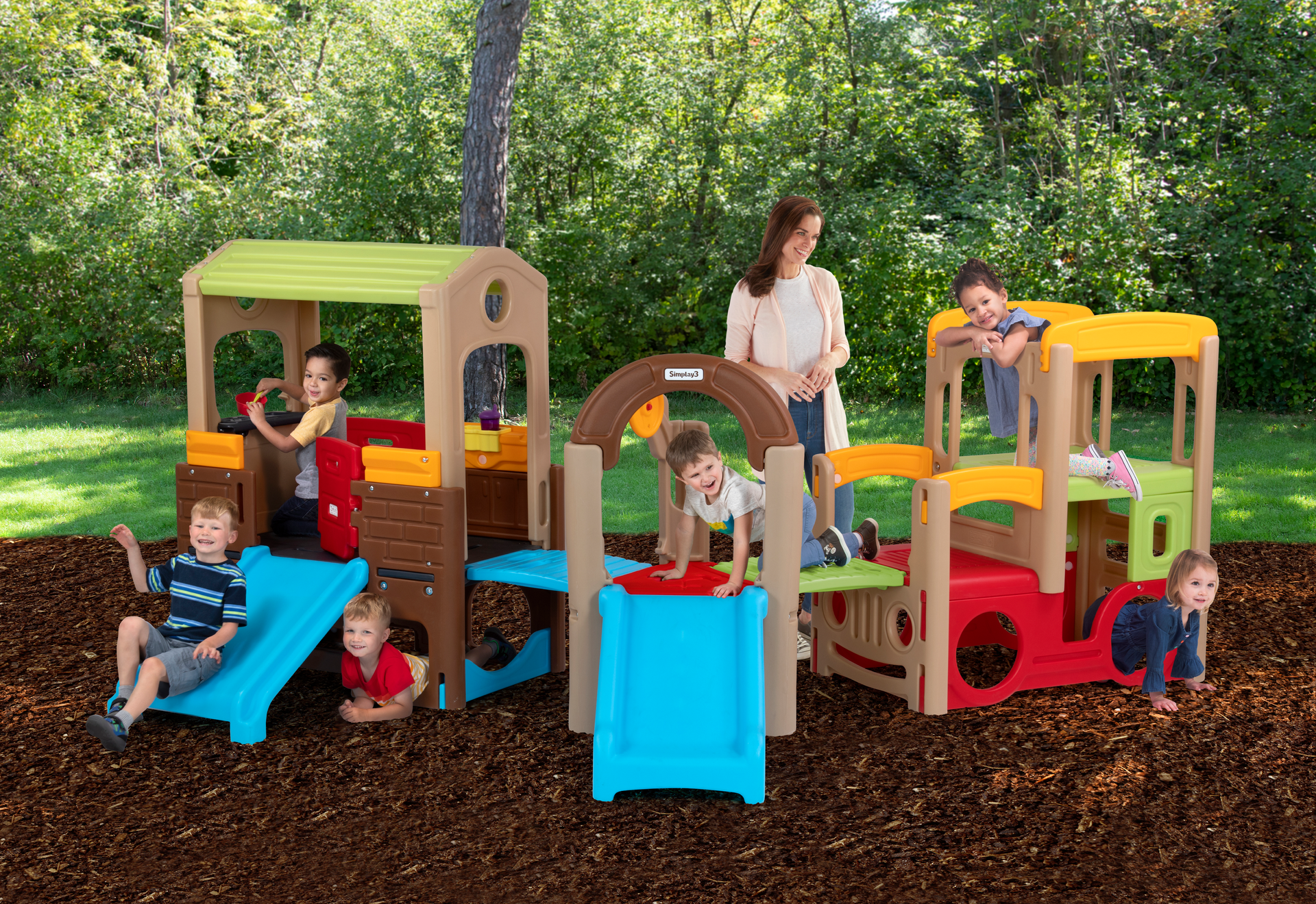 Playsets in Simplay3's Young Explorers Modular Play System can be attached in a variety of combinations. From left, they are the Young Explorers Discovery Playhouse, the Young Explorers Activity Climber and the Young Explorers Adventure Climber.