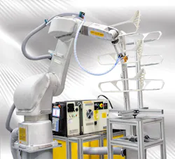 A Fanuc P-40iA robot spray-coats a vehicle tail light. A Fanuc P-40iA robot spray-coats a vehicle tail light.