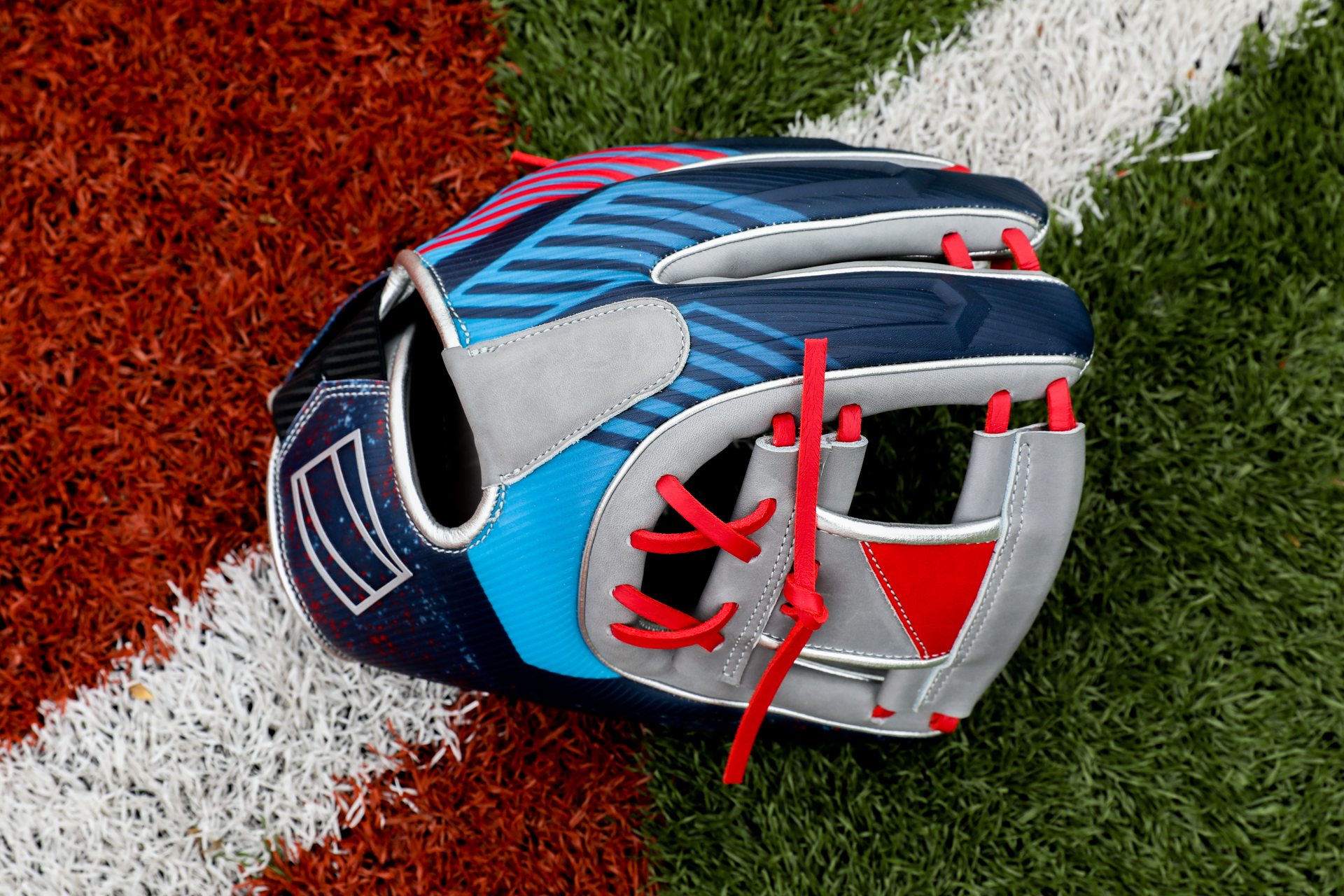 The REV1X glove incorporates an intricate lattice in the pinky and thumb inserts.