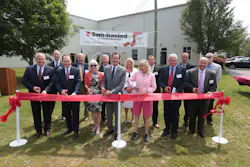 James Murphy, third from left, prepares to cut a ribbon at Davis-Standard's die-cell center addition in July 2017. James Murphy, third from left, prepares to cut a ribbon at Davis-Standard's die-cell center addition in July 2017.