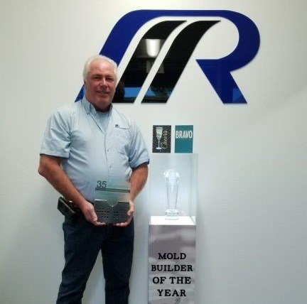 Rick Finnie poses with his award as American Mold Builders Association's 2019 Mold Builder of the Year.
