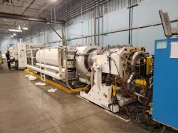 At its Amtrol plant in West Warwick, R.I., Worthington -- a steel-products manufacturer -- has installed a new line for extruding plastic pipe it uses to make large vessels for holding water. At its Amtrol plant in West Warwick, R.I., Worthington -- a steel-products manufacturer -- has installed a new line for extruding plastic pipe it uses to make large vessels for holding water.