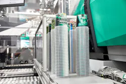 An Arburg work cell with a Brink mold and robot demonstrated injection-compression molding of thin-wall cups at K 2022 and Arburg Anniversary Days. An Arburg work cell with a Brink mold and robot demonstrated injection-compression molding of thin-wall cups at K 2022 and Arburg Anniversary Days.