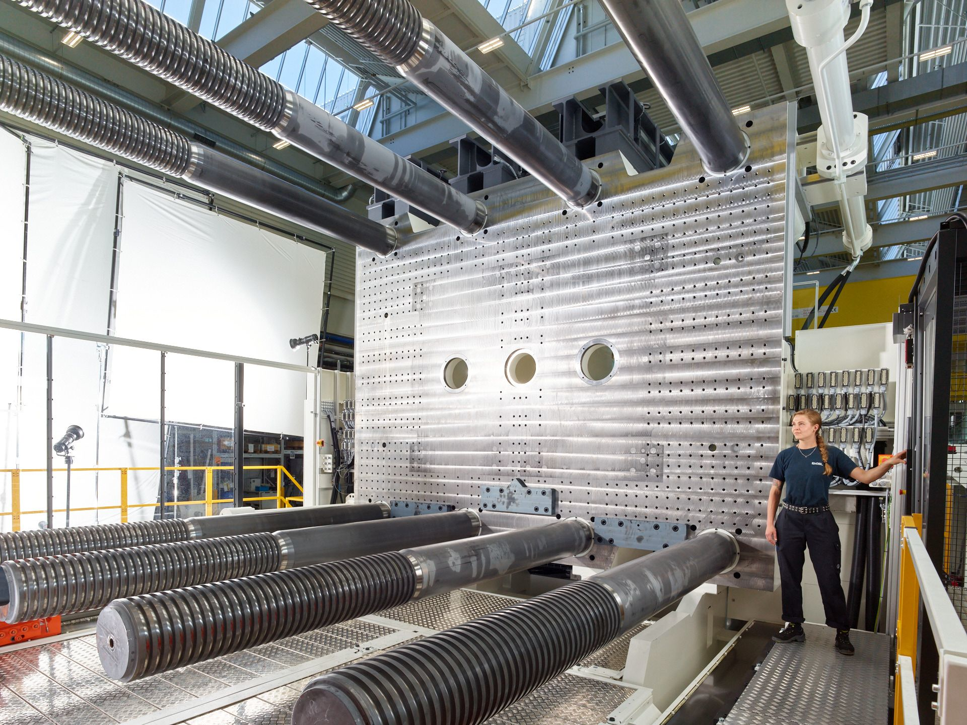 An employee works on one of the new injection molding lines installed at Infiltrator Water Technologies in Winchester, Ky.