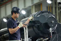 Workers build an injection molding machine at LS Mtron's factory in South Korea. Workers build an injection molding machine at LS Mtron's factory in South Korea.