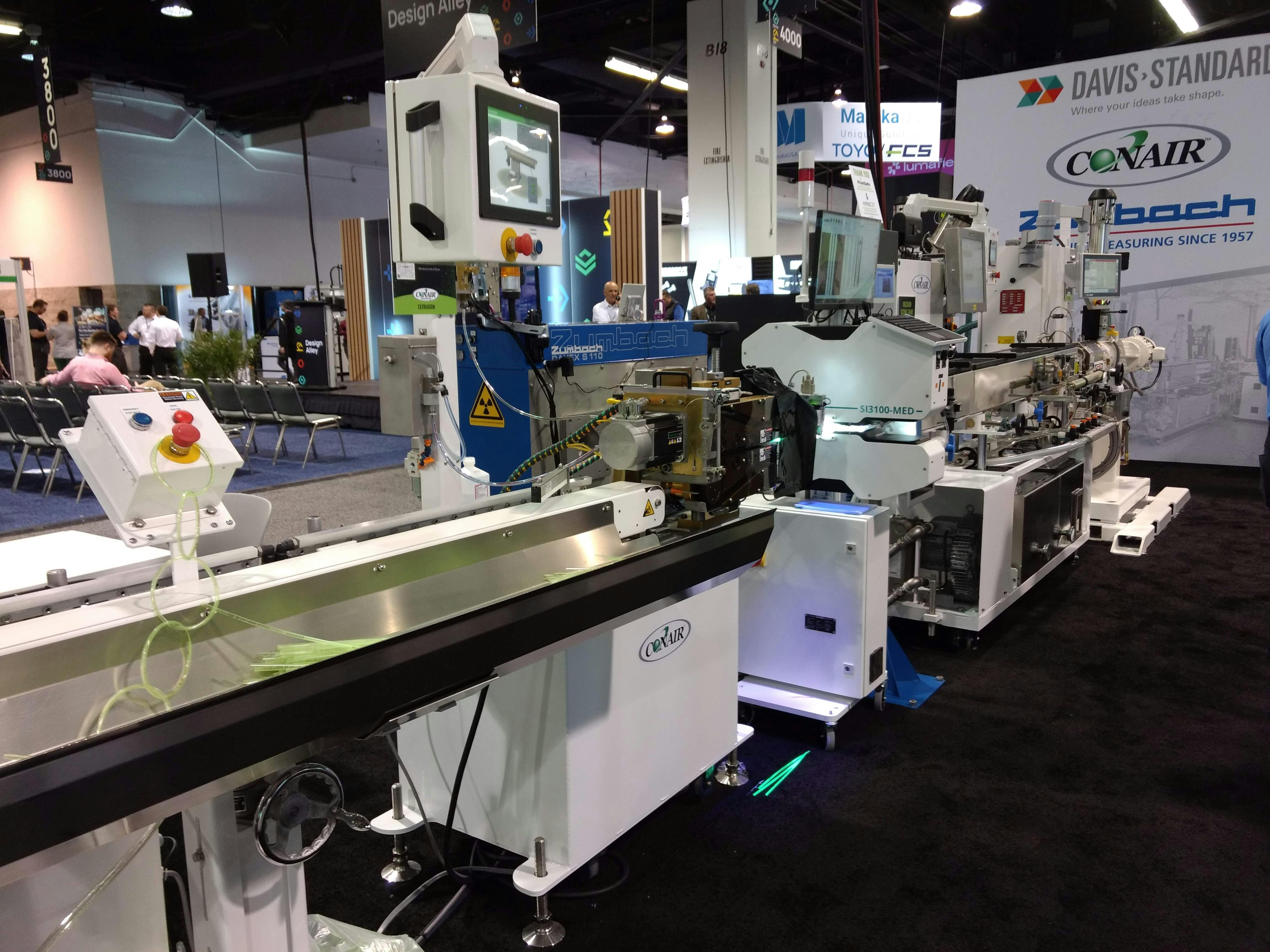 Conair, Davis-Standard and Zumbach produced photoluminescent tubing at this demonstration cell at MD&M/Plastec West.