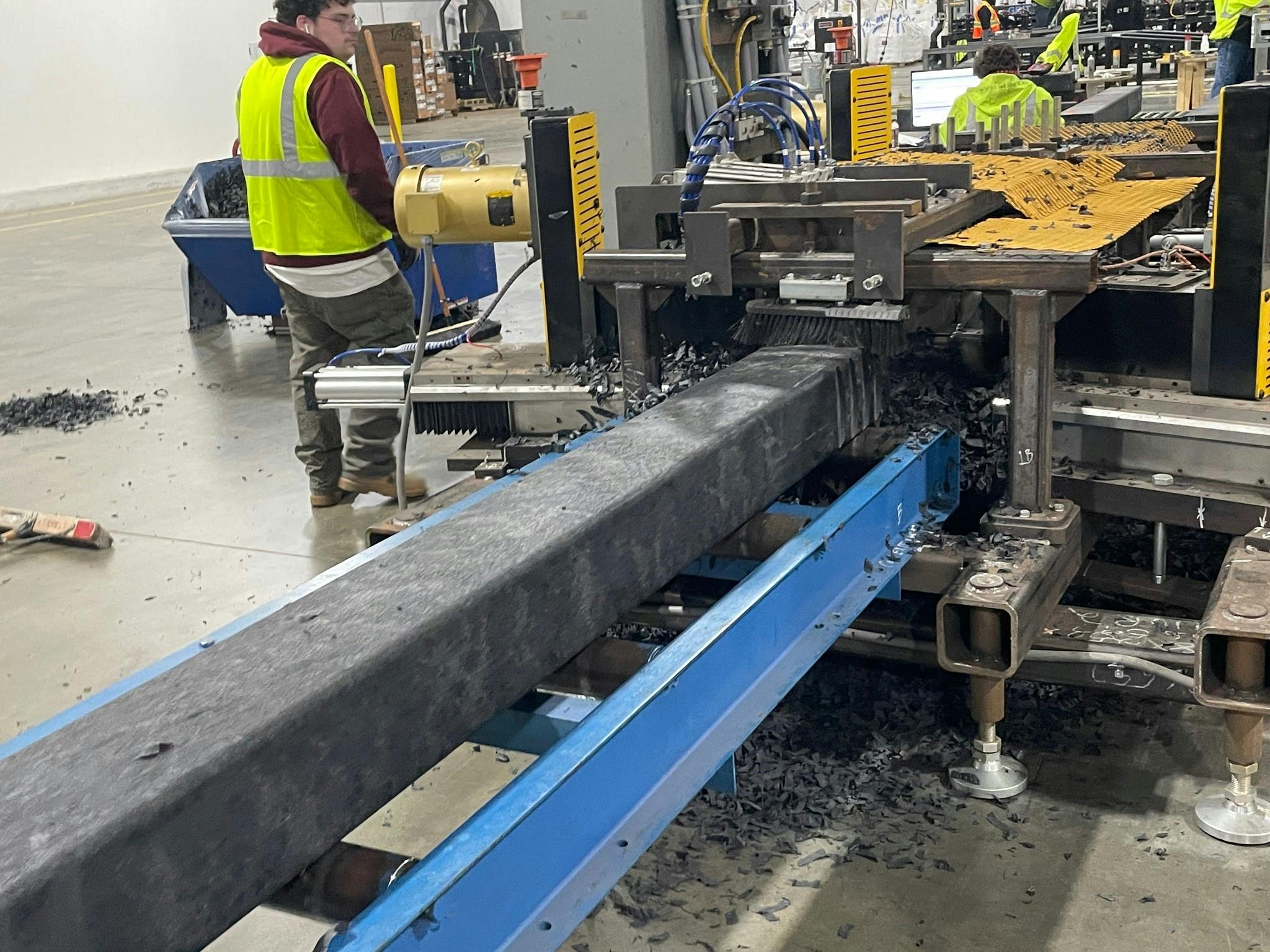 An Evertrak 7000 composite railroad tie passes through the texturing station, which creates additional grip on the tie's surface.
