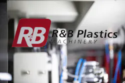 R&B Plastics Machinery logo on the access door of a blow molding machine R&B Plastics Machinery logo on the access door of a blow molding machine