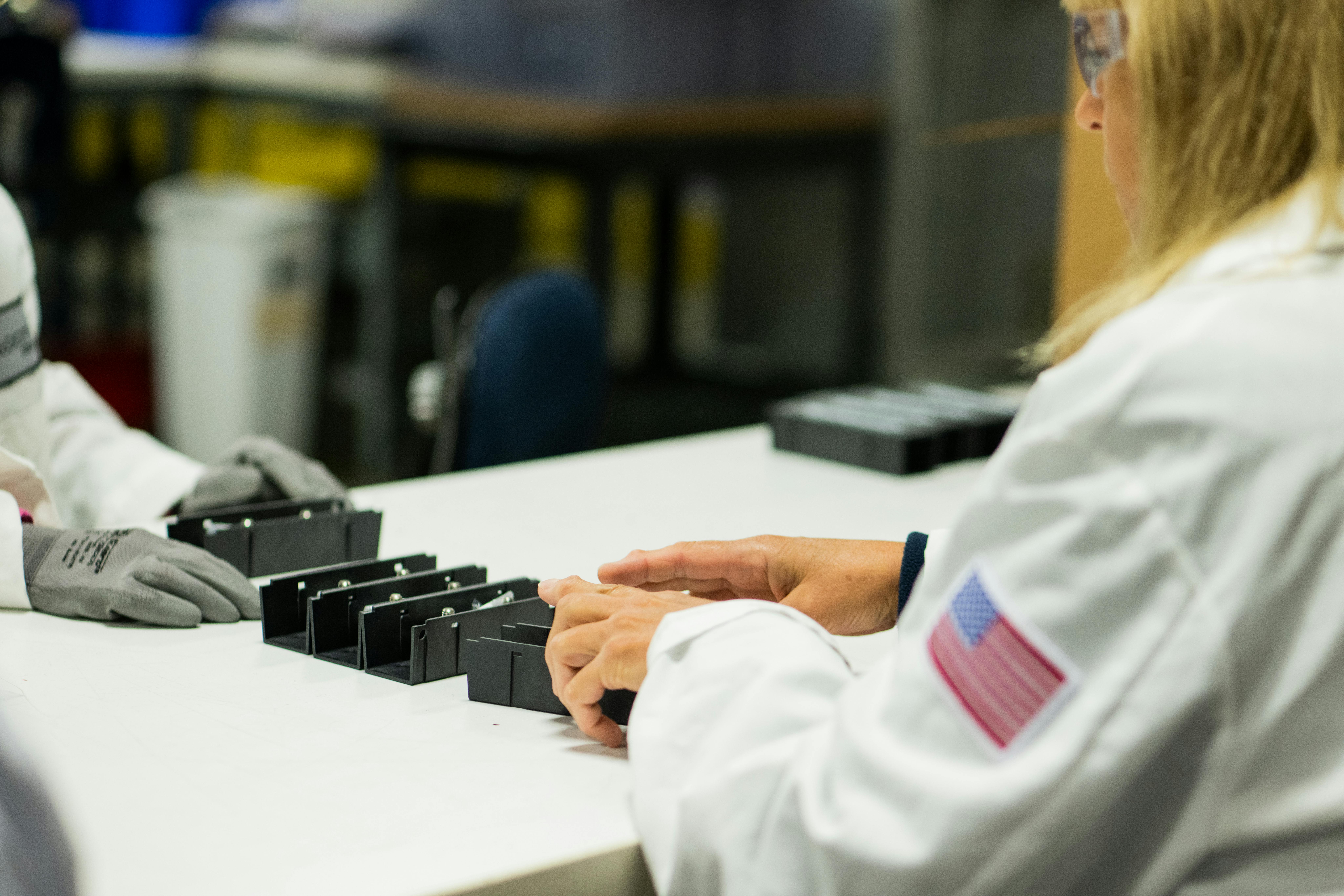 Velocity Group employees work to assemble a component used for industrial power sources. Despite being in a rural area. the Byesville, Ohio, company has surmounted labor challenges by building a positive impression in the community as a good employer.