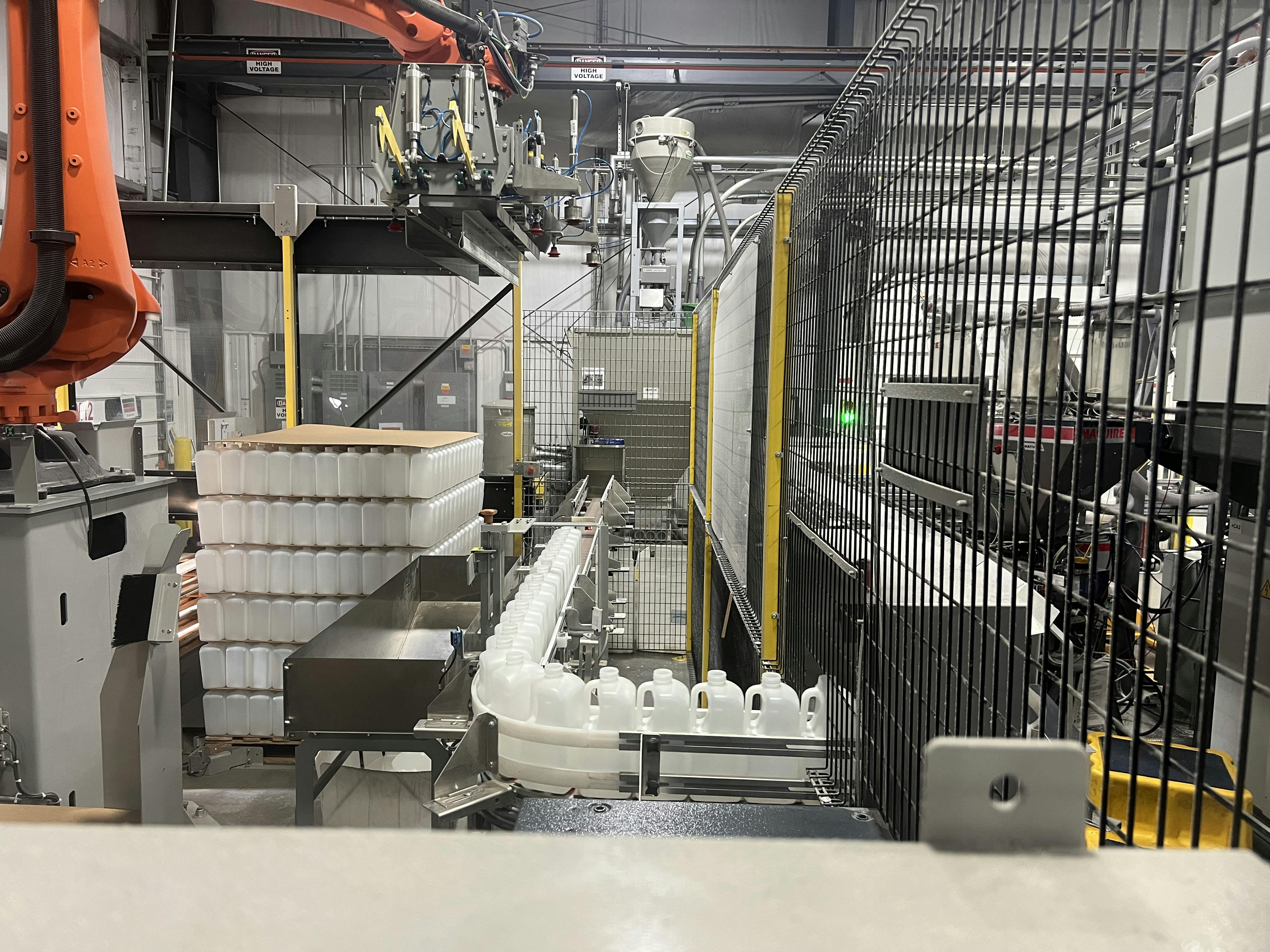 This automatic palletizer is handling 64-ounce bottles on 44-inch by 56-inch pallets.