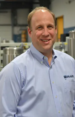Jason Sears, president and owner of Dri-Air Industries, in a blue shirt on the shop floor. Jason Sears, president and owner of Dri-Air Industries, in a blue shirt on the shop floor.