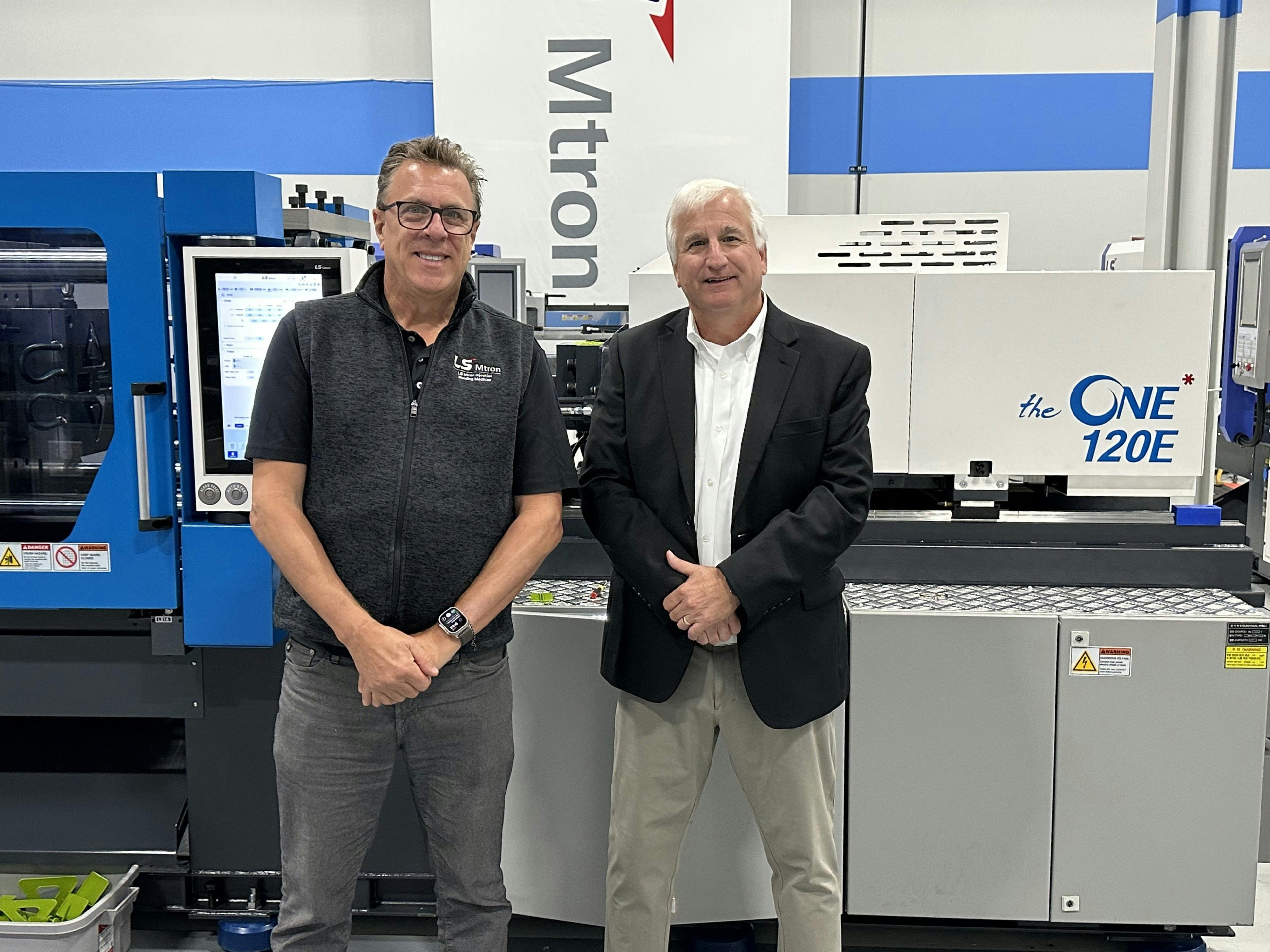Peter Gardner, left, is retiring as president of LS Mtron Injection Molding Machine USA. Paul Caprio, right, president of sales, will be taking over some of his duties. They were photographed in late 2023 at the company's Wood Dale, Ill. technical center.