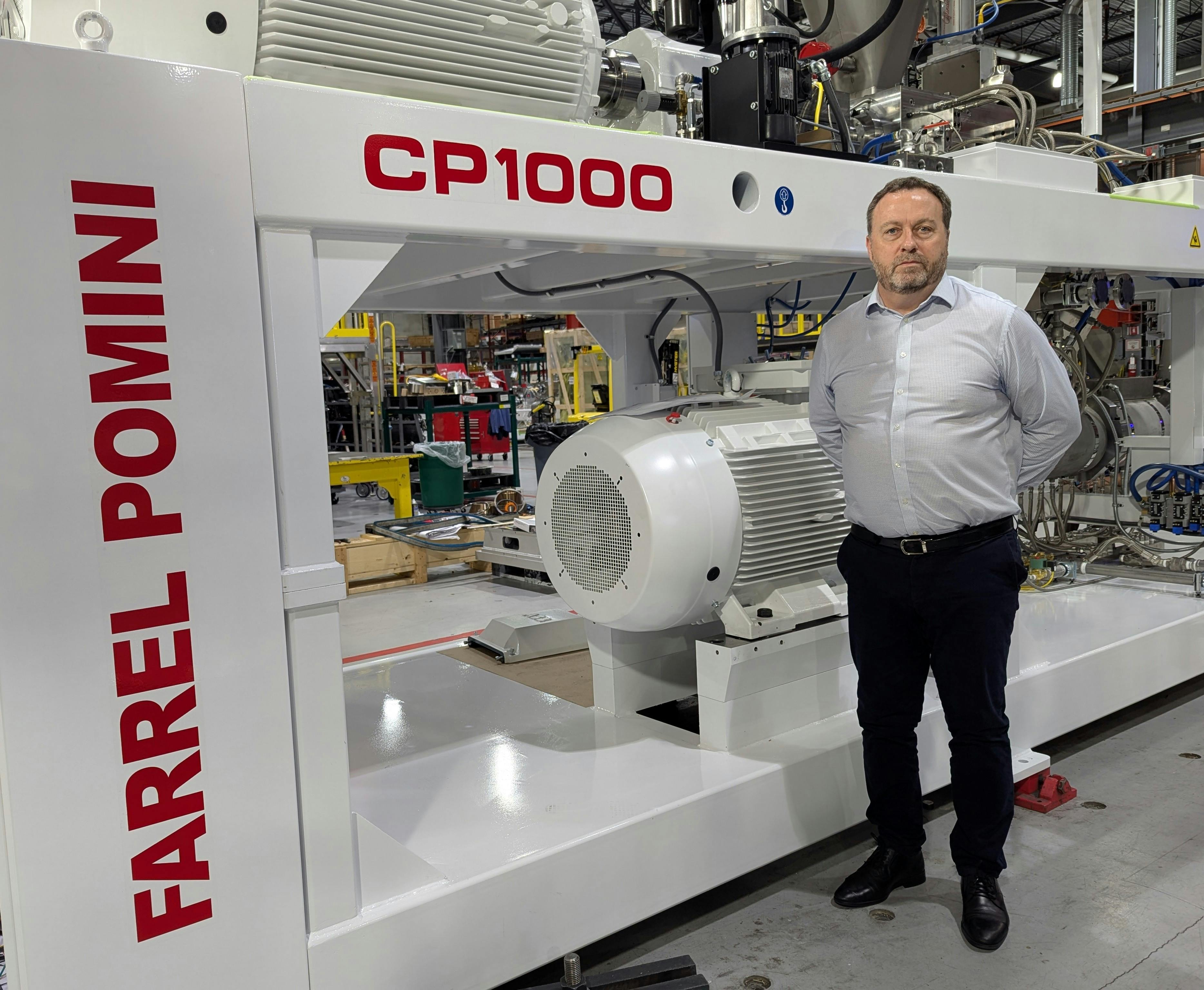 Paul Lloyd, president of Farrel Pomini, with one of his company's CP1000 continuous mixers.