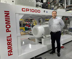 Paul Lloyd, president of Farrel Pomini, with one of his company's CP1000 continuous mixers. Paul Lloyd, president of Farrel Pomini, with one of his company's CP1000 continuous mixers.