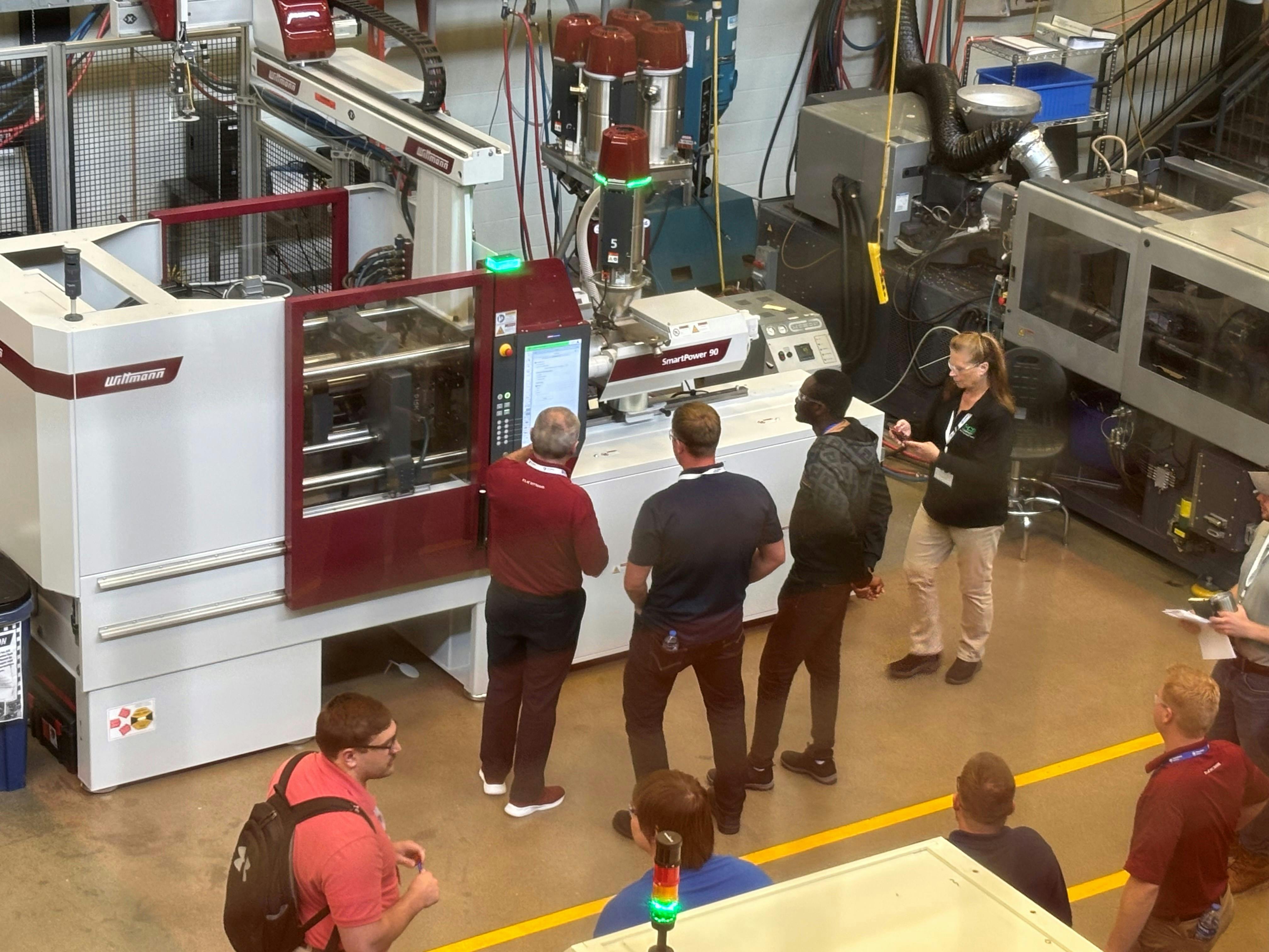 Wittmann showcases its donated work cell at Penn State Behrend during live demos at the June 2025 Innovation and Emerging Plastics Technologies Conference.