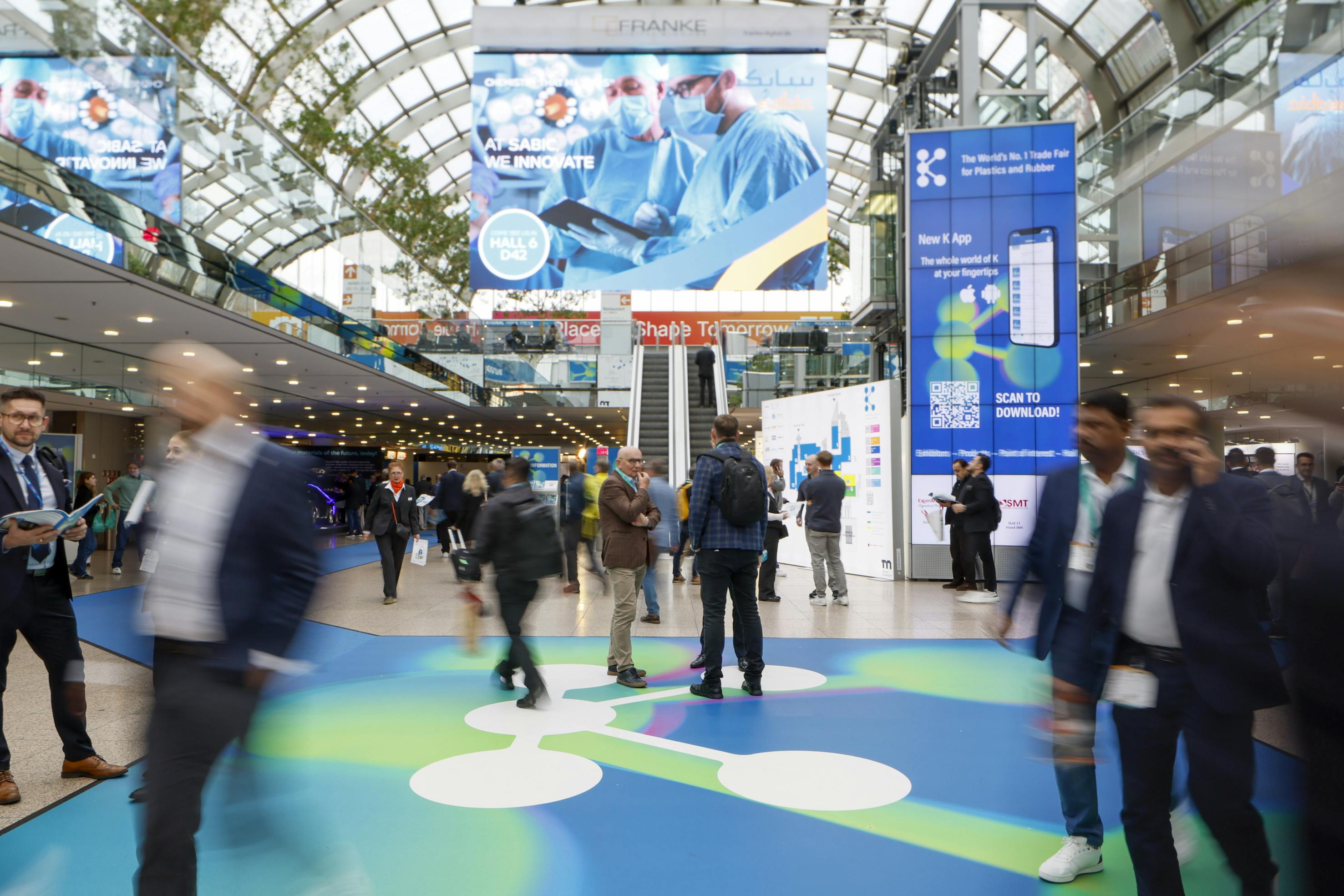 Attendees walk the floor in one of the halls at K 2025.