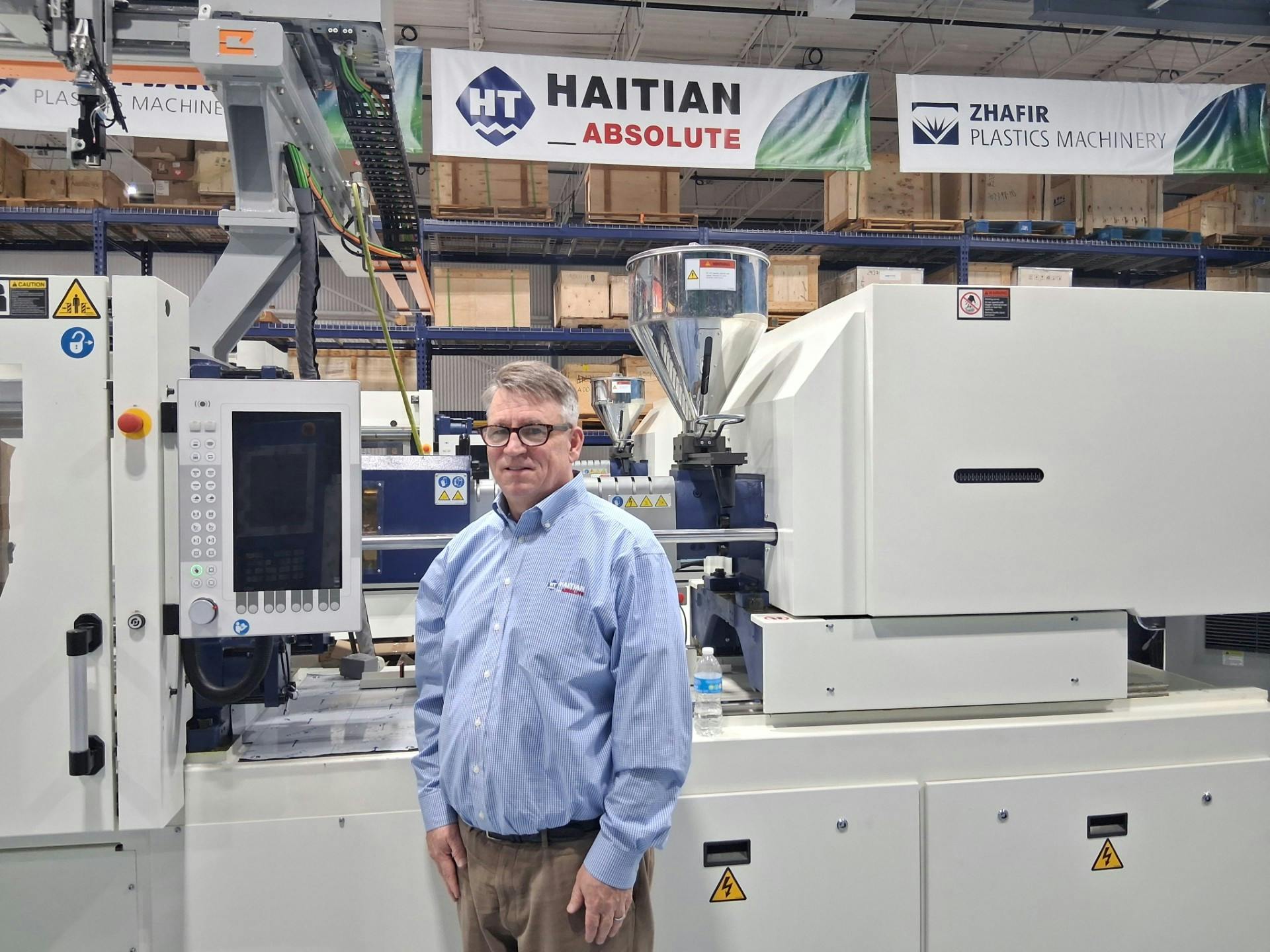 Glenn Frohring works at the Parma, Ohio, facility of Absolute Haitian Inc., which he owns with two partners. The facility ships parts, including screws, barrels and automation equipment, to customers and offers training on injection molding machines and robots on site.