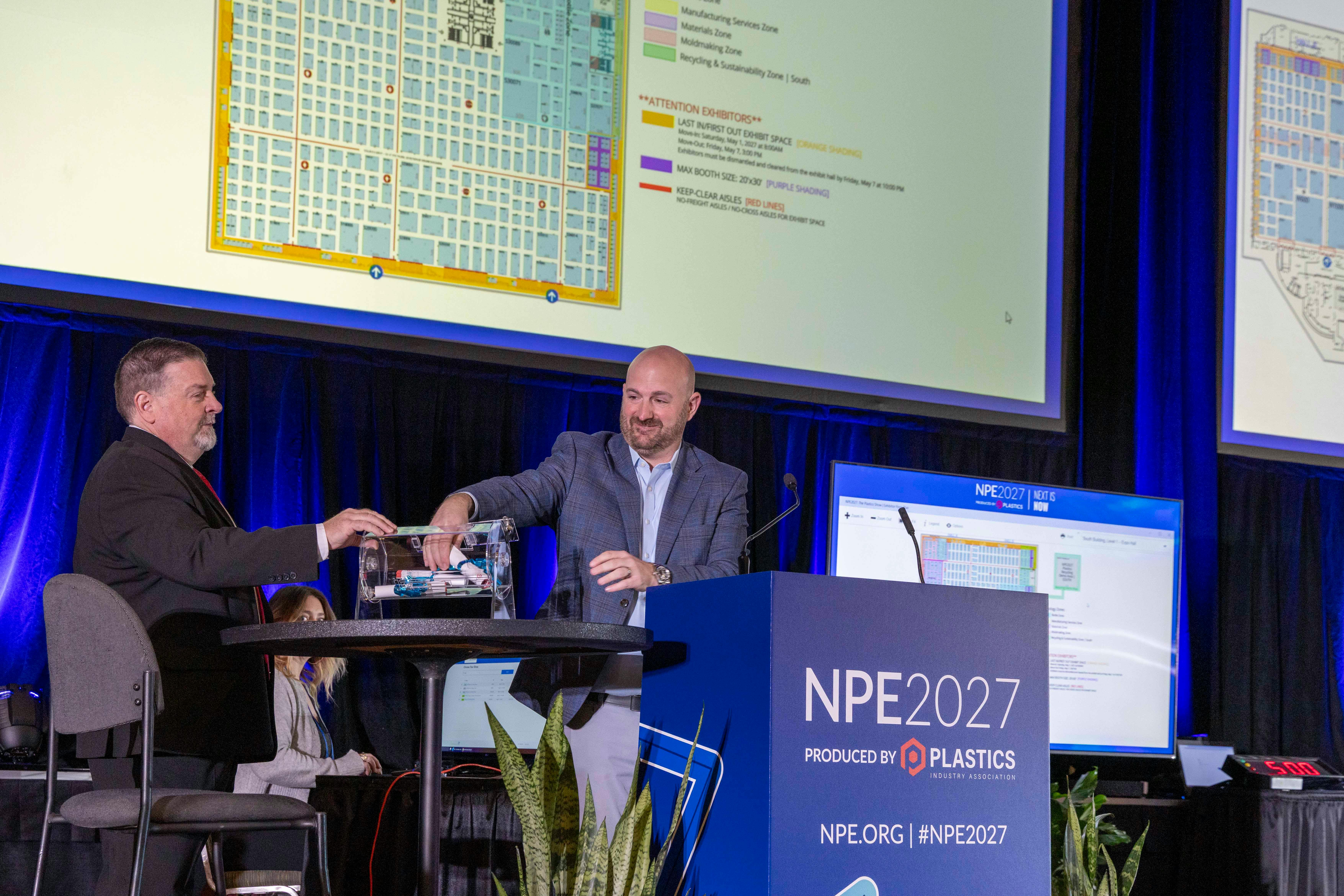 Chris Parrillo of Yushin (left), NPE2027's executive committee chair, and PLASTICS President and CEO Matt Seaholm at the Space Selection event in Orlando.