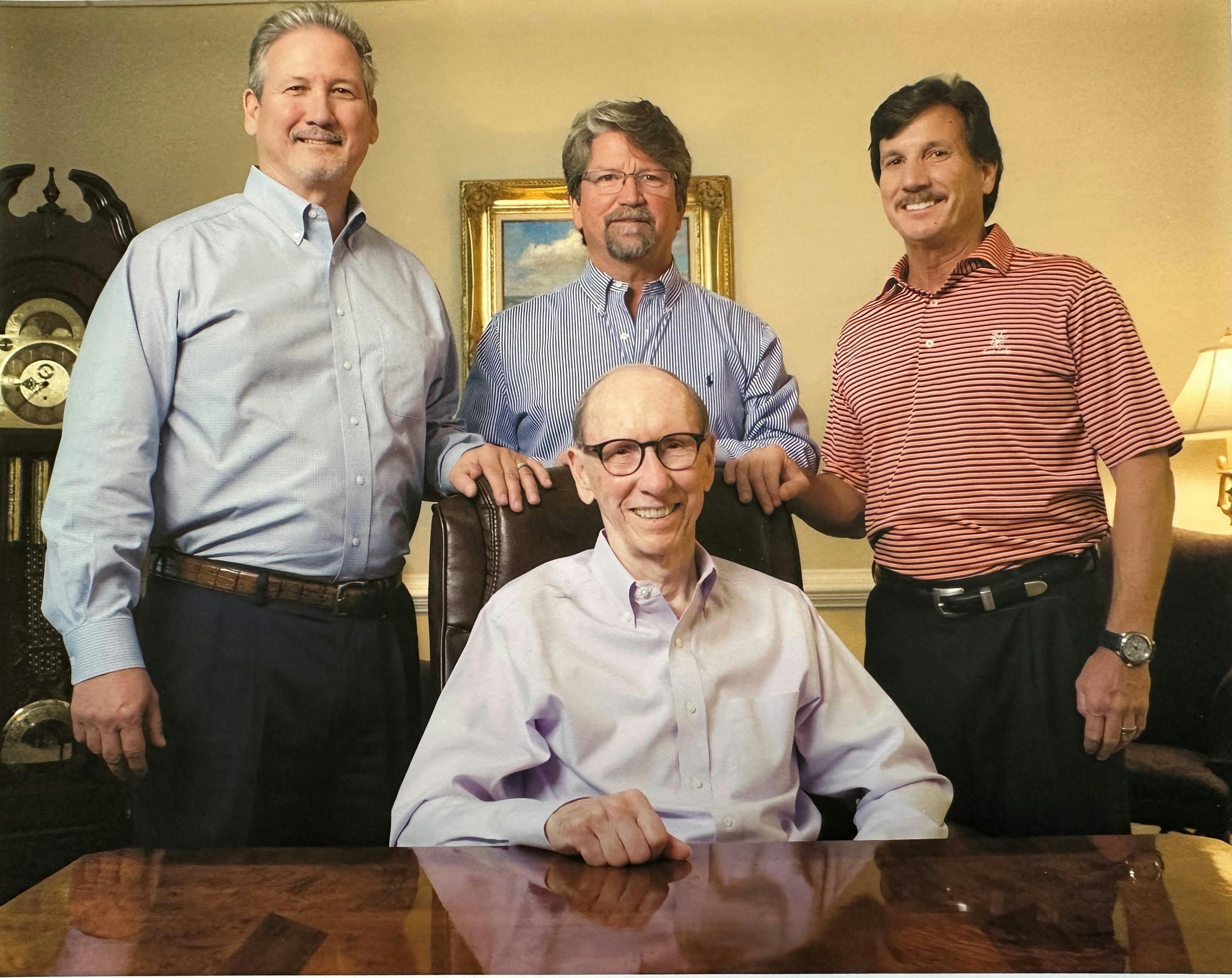 Charles Sewell sits in front of his sons, from left, John, Scott and Drew.