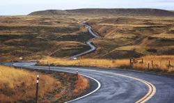 66fdb9cdde5fd13c2c547eae Pavedroadwindingthroughbrowngrasshillsoffintodista 66fdb9cdde5fd13c2c547eae Pavedroadwindingthroughbrowngrasshillsoffintodista