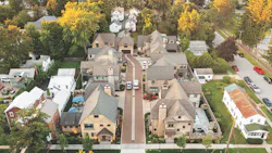 The cluster of seven single-family homes is built on a former industrial site within walking distance of downtown Saratoga Springs and the Saratoga Race Course. Each home features a unique stone or stucco exterior, and the community is unified by the use of matching custom cypress trim on the homes’ stoops, bracket details, and porches. The cluster of seven single-family homes is built on a former industrial site within walking distance of downtown Saratoga Springs and the Saratoga Race Course. Each home features a unique stone or stucco exterior, and the community is unified by the use of matching custom cypress trim on the homes’ stoops, bracket details, and porches.