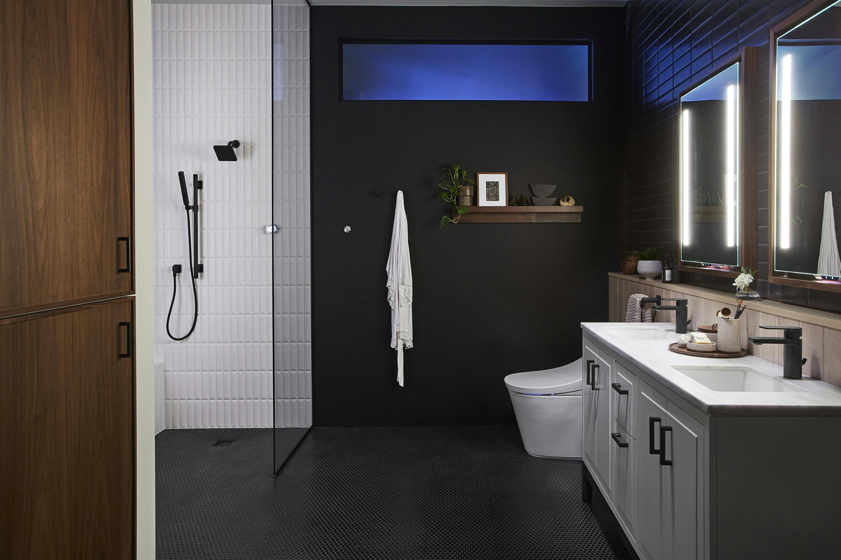 66fdbbaee63fdc6c8e457c82 Kohlersmartbathroomblackwallswhitetiles
