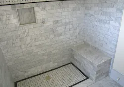 In the case of custom showers, such as this curbless example, the shower pan tends to be fabricated on site and finished with ceramic tile or a similar hard-surface material, such as the marble tile shown here. In the case of custom showers, such as this curbless example, the shower pan tends to be fabricated on site and finished with ceramic tile or a similar hard-surface material, such as the marble tile shown here.