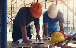 66fdc9bc3cabd9ec17a6af2a Builders20looking20at20plansmin 66fdc9bc3cabd9ec17a6af2a Builders20looking20at20plansmin