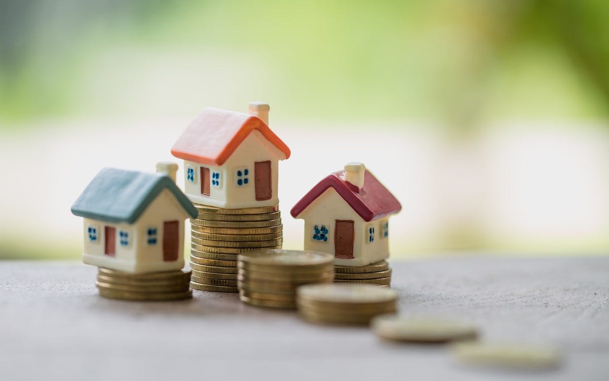 66fdca4fdbd68e1aec4abcfe Houses20stacked20on20coinsmin