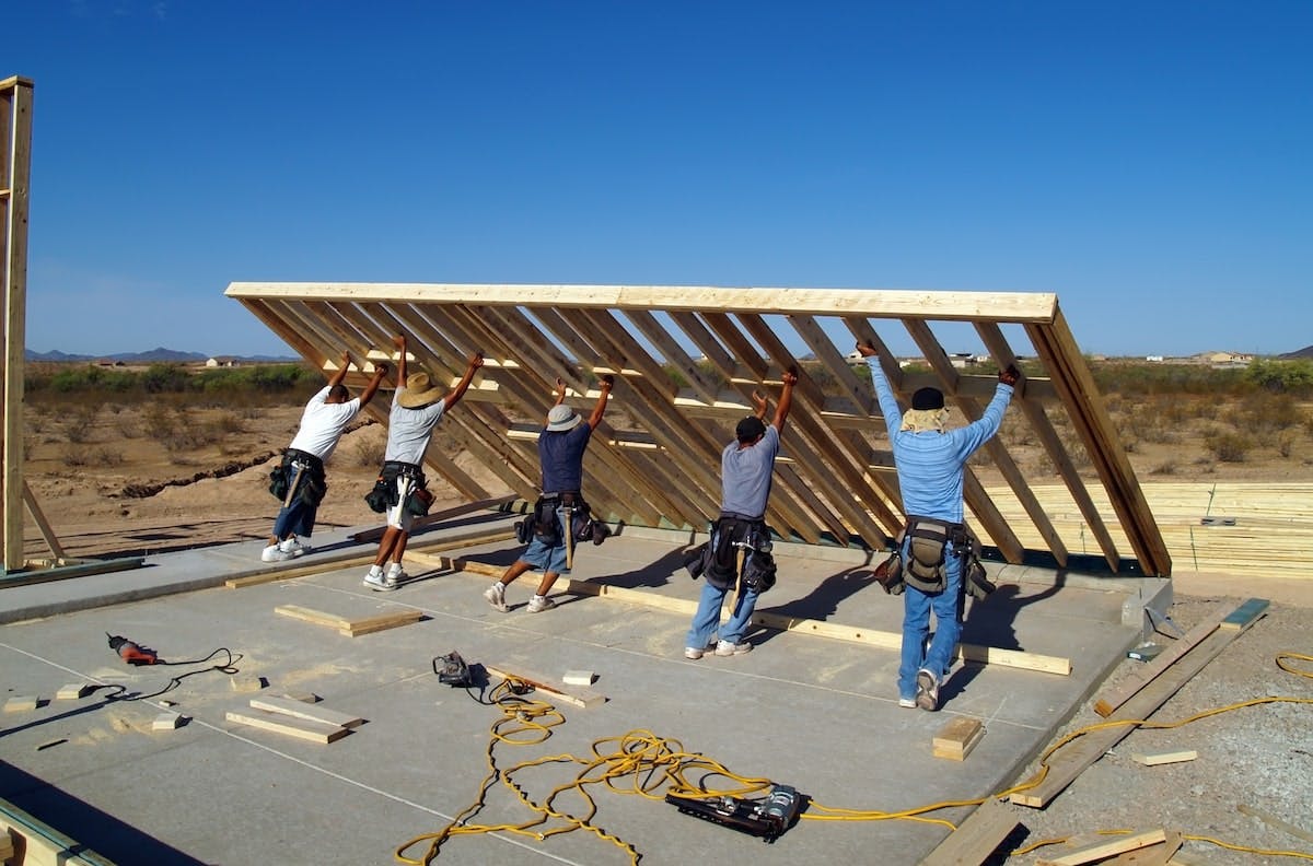 66fdca61dbd68e66d34abd1f Building20crew20raising20wallmin