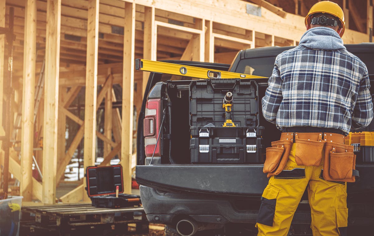 66fdcaa3dbd68e742f4abdcc Constructionworkerstandingbyworktruckmin