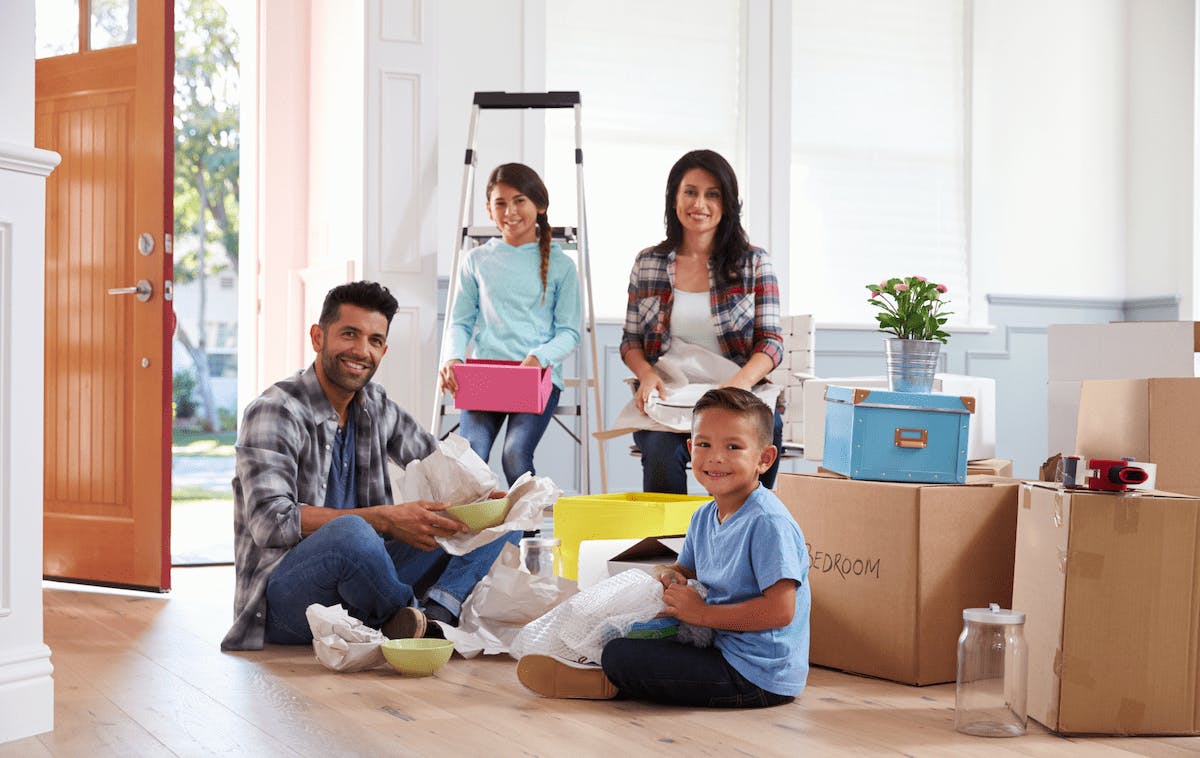 66fdcd34a5dba0bb85464288 Hispanicfamilyunpackingmovingboxesnewhomemin